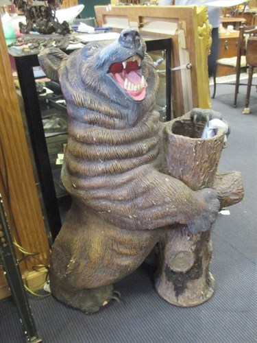 Lot 387 - A terracotta bear stick stand in Black Forrest...