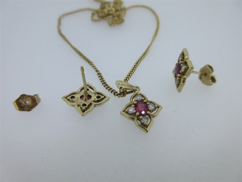 Lot 375 - A ruby and diamond pendant and earstud suite set in 9ct gold with a gold chain