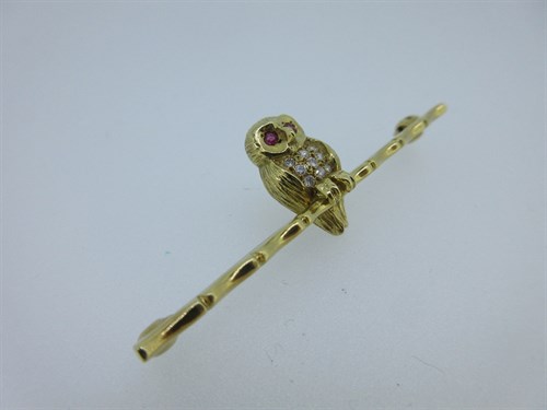 Lot 385 - An 18ct gold, ruby and diamond owl bar brooch by Cropp & Farr