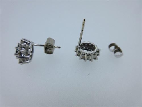 Lot 428 - A pair of 18ct white gold sapphire & diamond cluster earstuds