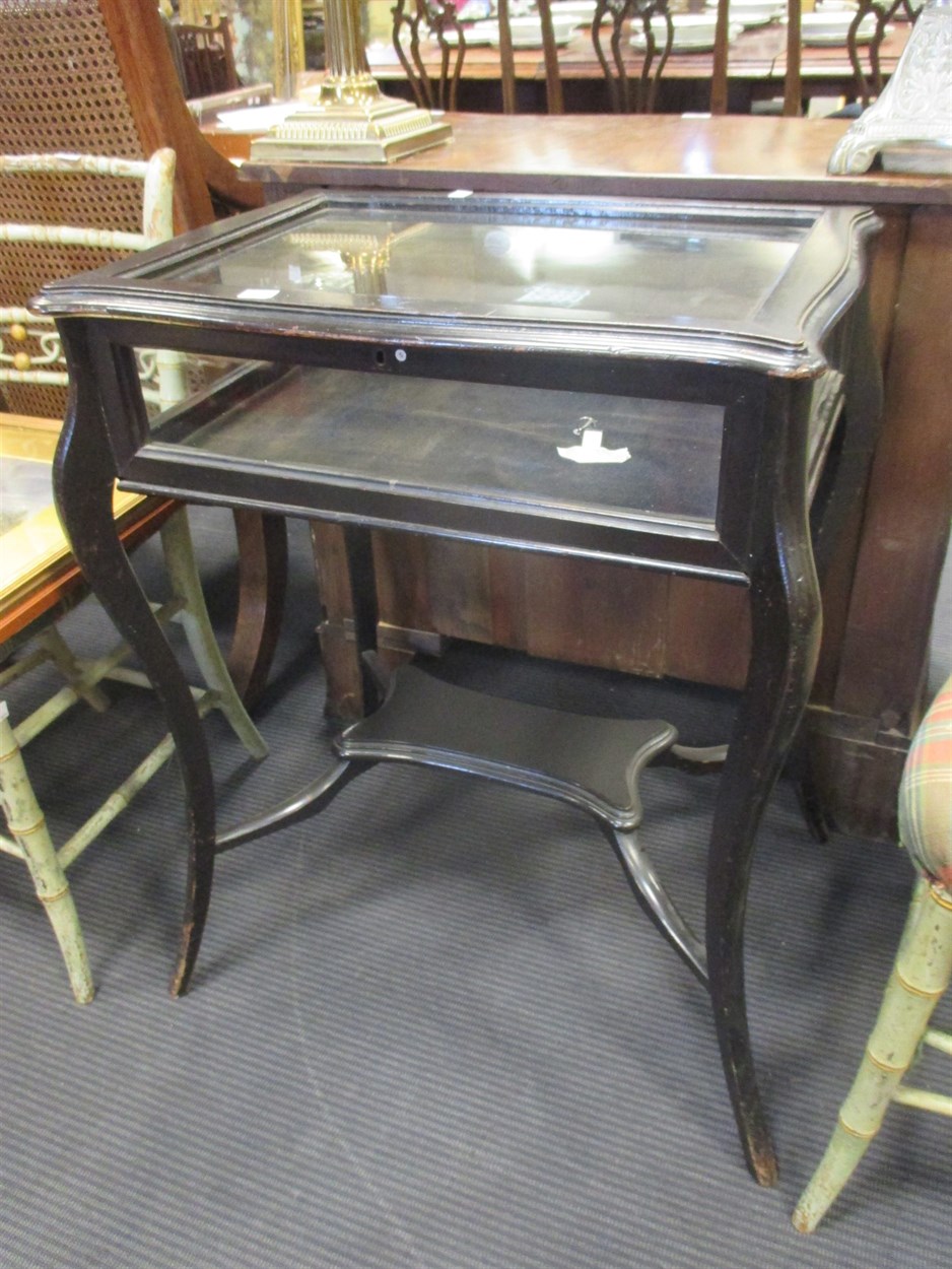 Lot 456 - An ebonised glass top bijouterie display table...