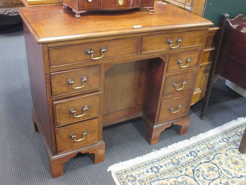 Lot 422 - A George III and later mahogany kneehole desk,...
