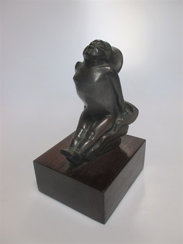 Lot 150 - A bronze figure of a female on a wooden stand...