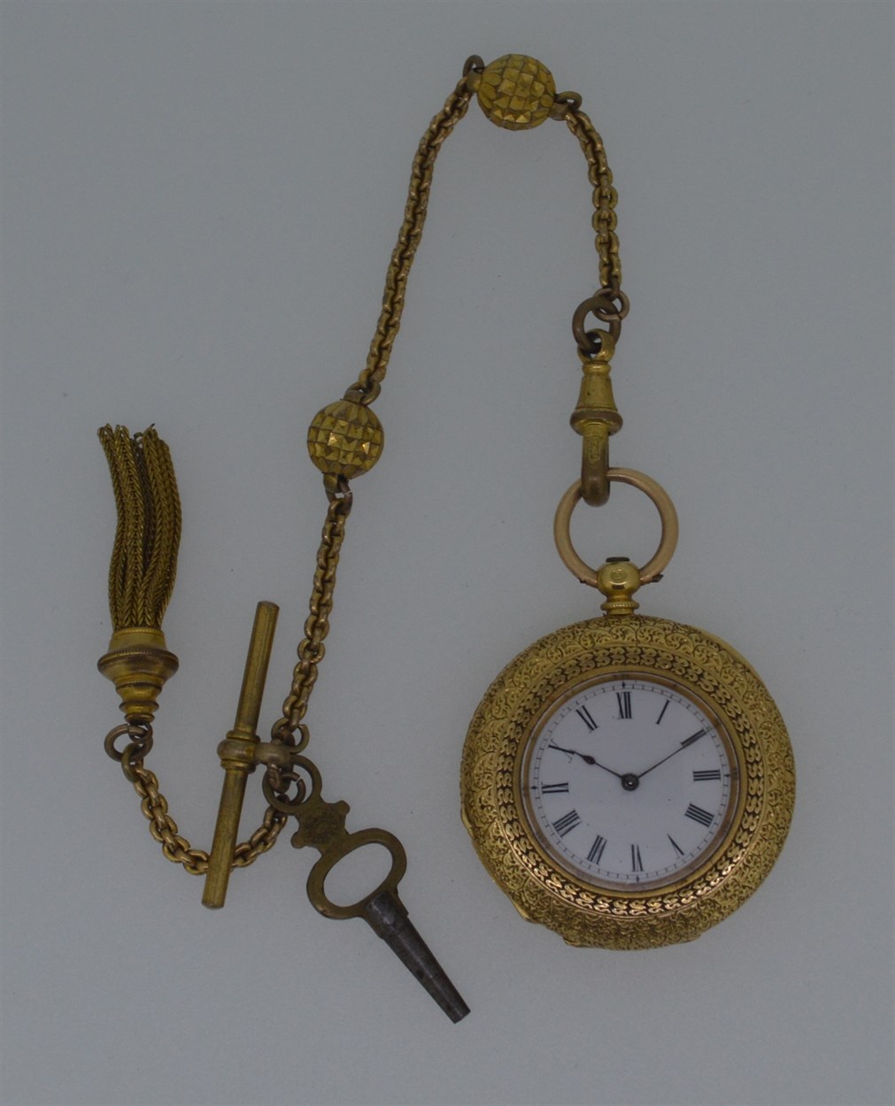 Lot 168 - An unsigned continental open faced pocket watch with accompanying Albertina chain