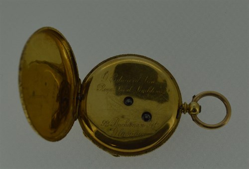 Lot 168 - An unsigned continental open faced pocket watch with accompanying Albertina chain