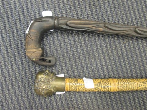 Lot 119 - Two tribal walking sticks