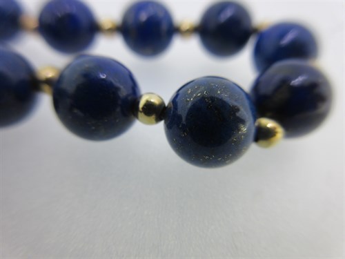 Lot 368 - A lapis lazuli bead necklace together with a cultured pearl necklace