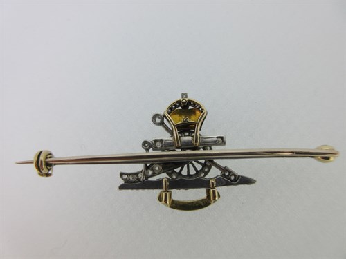 Lot 433 - A diamond and enamel sweetheart bar brooch for the Royal Artillery