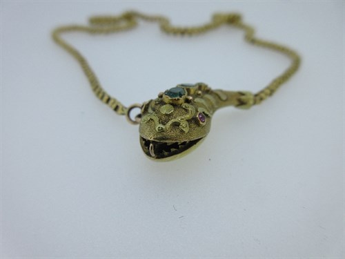Lot 343 - A Victorian snake necklace set with emeralds