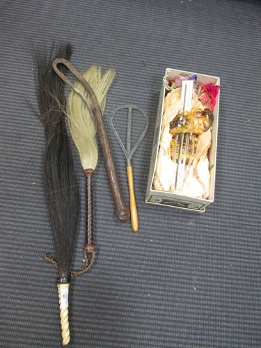 Lot 80 - Two horse hair fly whisks, a leather crop hair...