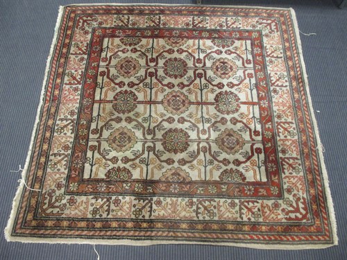 Lot 508 - A brown ground square rug, 124 x 127cm