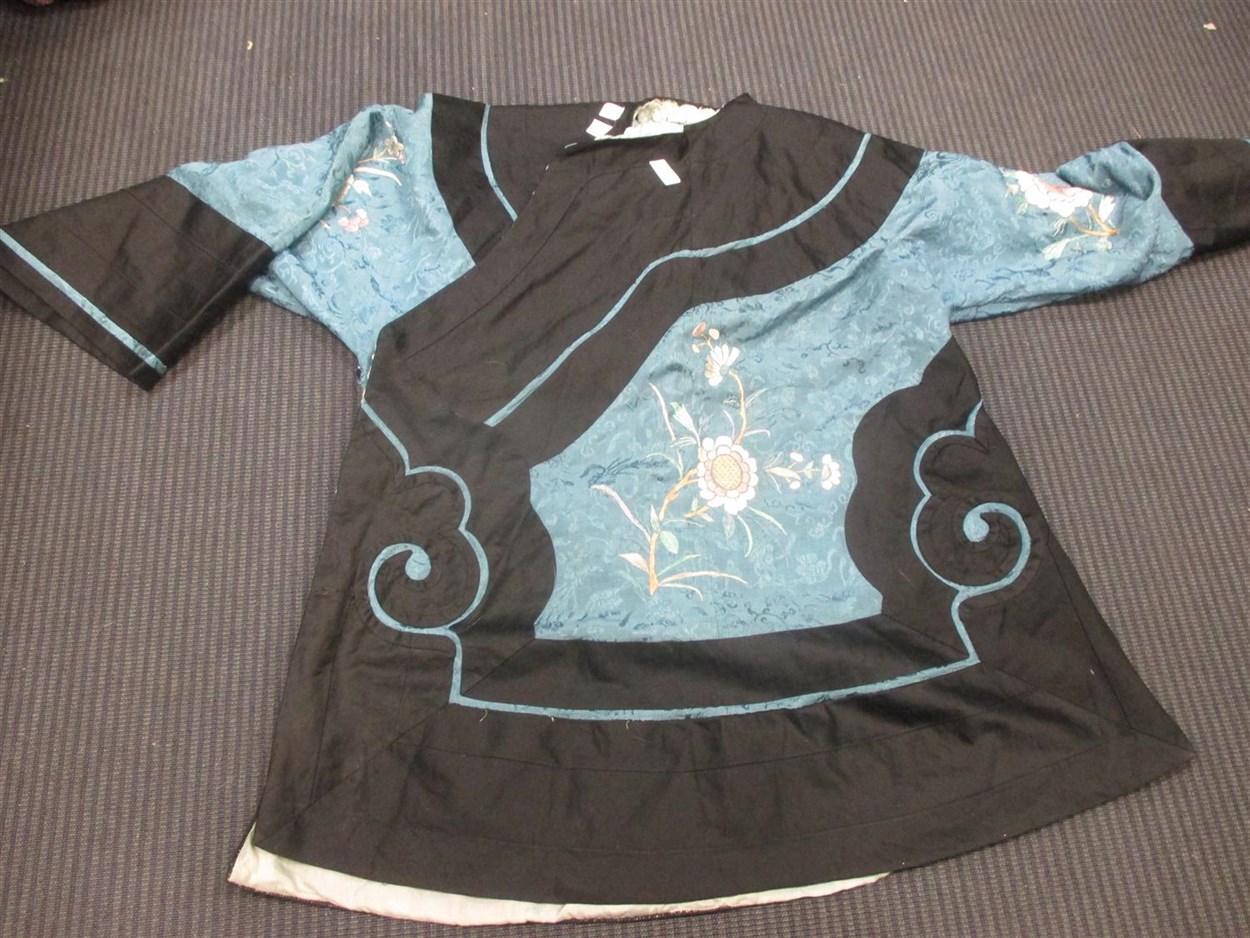Lot 433 - A Chinese silk robe, in navy blue and light...