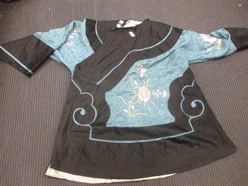 Lot 433 - A Chinese silk robe, in navy blue and light...
