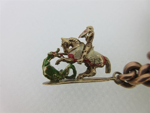 Lot 422 - A 9ct gold charm bracelet with quirky and mainly hallmarked charms