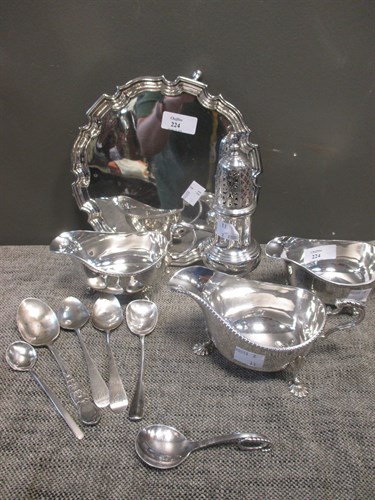 Lot 224 - A collection of silverware to include a sugar...