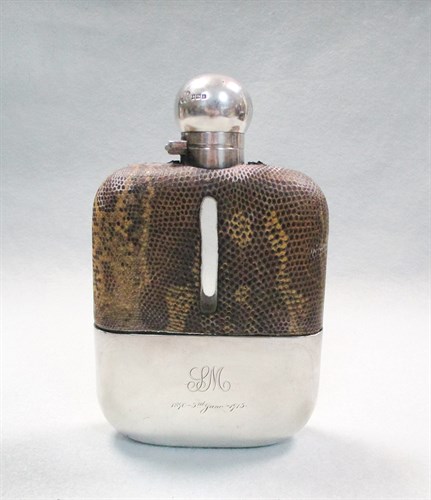 Lot 117 - A George V silver and glass hip flask