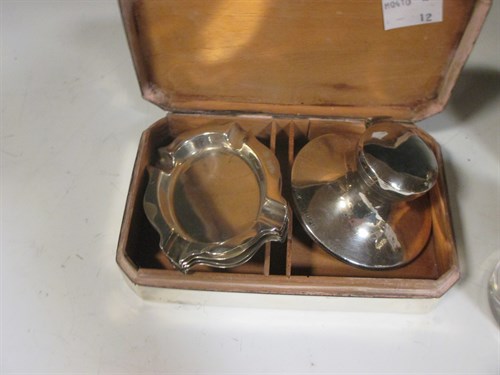 Lot 192 - A set of four silver ashtrays, a small silver...