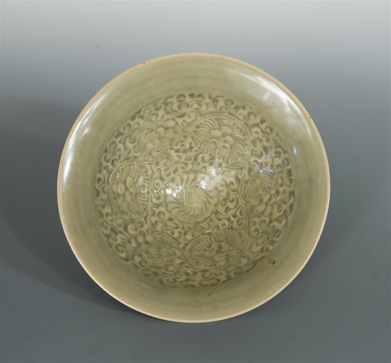 Lot 48 - A Northern Song-Jin dynasty Yaozhou celadon moulded conical bowl