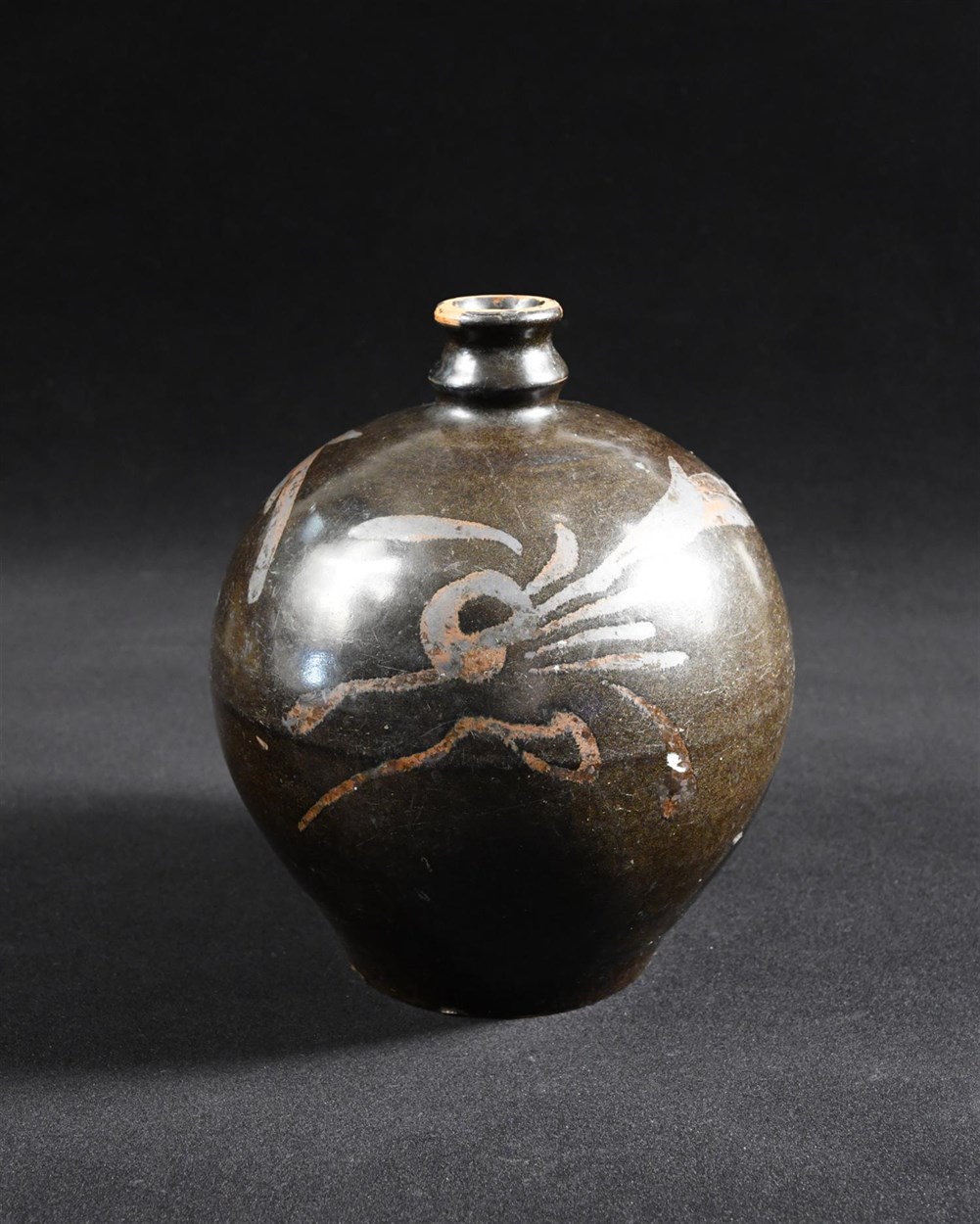 Lot 39 - A Northern Song dynasty Cizhou type ovoid bottle 'Xiaokou ping'
