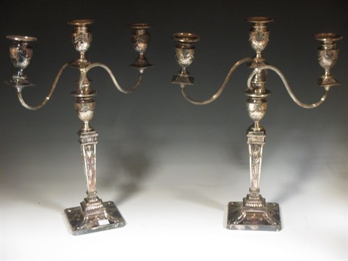 Lot 218 - A pair of silver plated candlesticks in the...