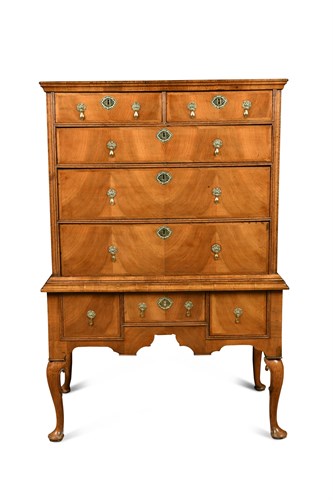 Lot 387 - A Queen Anne oak and walnut chest on stand