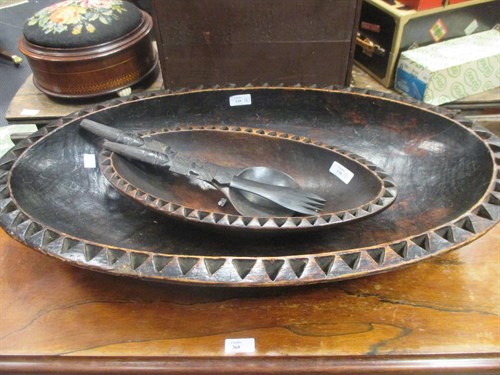 Lot 130 - A Tribal carved wood oval bowl, another and...