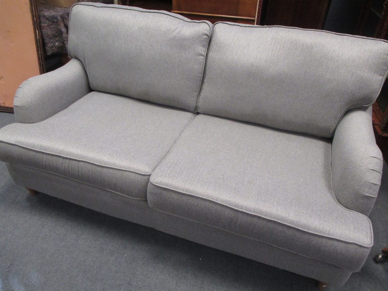 Lot 404 - A modern and little used DFS grey sofa, 175cm