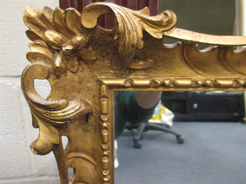 Lot 418 - A 19th/20th Century carved gilt-wood...