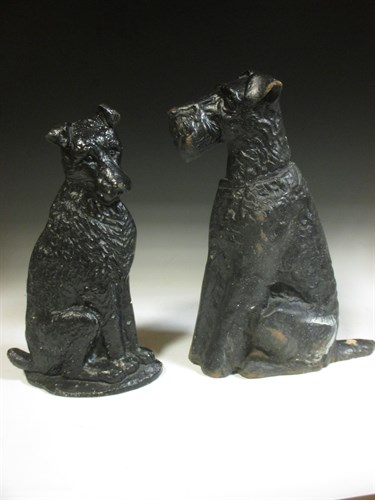 Lot 114 - An Airedale cast iron doorstop and another...