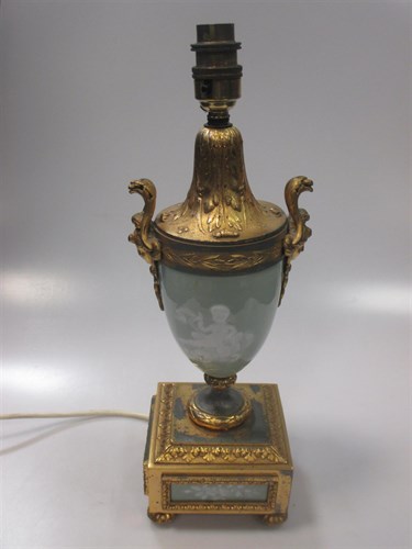 Lot 415 - A gilt metal and pate sur pate porcelain table...