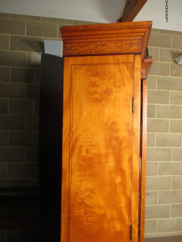 Lot 413 - A late 19th century satinwood and inlaid breakfront display cabinet