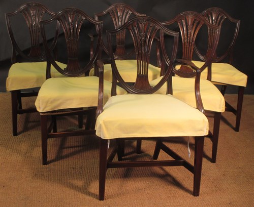 Lot 340 - A set of eight Hepplewhite style shield back...