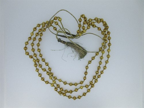 Lot 418 - A three row necklace of lantern shaped beads that test for gold