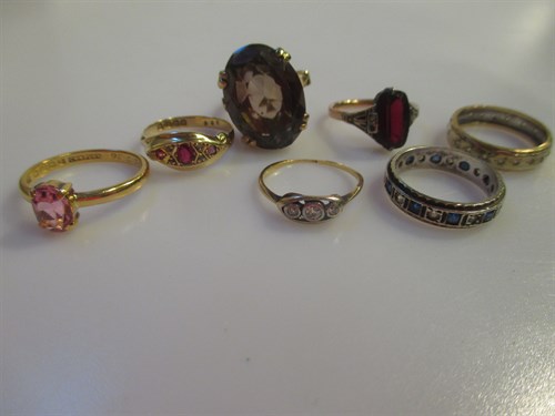 Lot 149 - Seven gem set rings, including a diamond three...