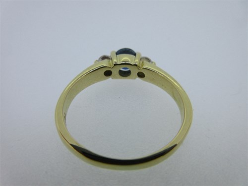 Lot 221 - An 18ct gold sapphire and diamond three stone ring by Cellini and an 18ct gold wedding band