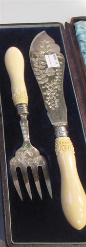 Lot 200 - A cased pair of Victorian silver fish servers