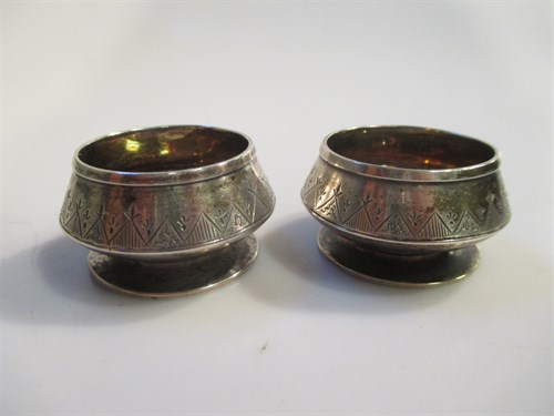 Lot 183 - A pair of miniature salt pots marked to the...