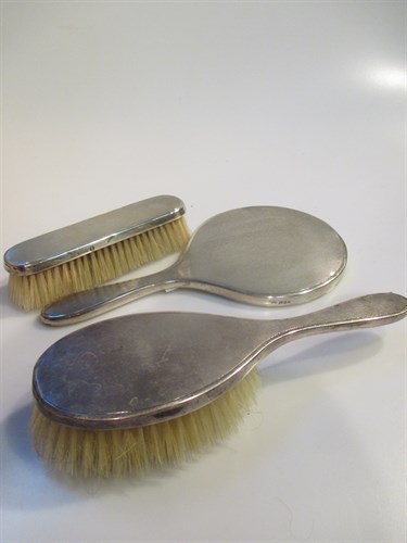 Lot 205 - A silver backed hand mirror and matching...