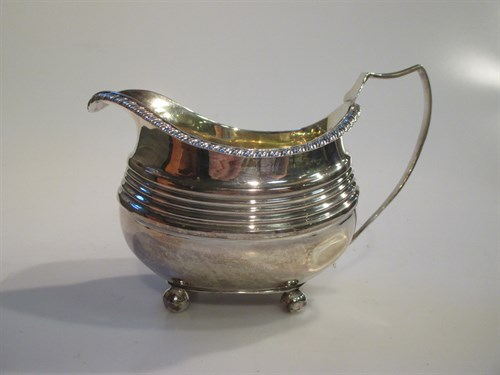 Lot 206 - A Regency cream jug, on four ball feet