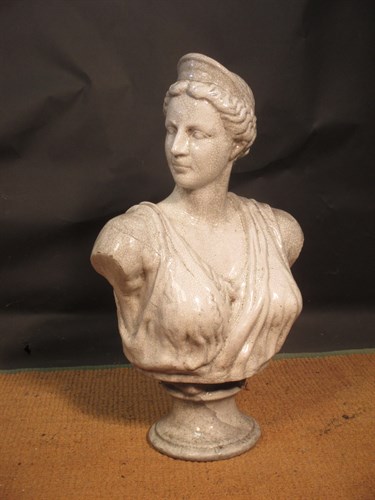 Lot 387 - A crackle glazed bust of Diana or Athene after...