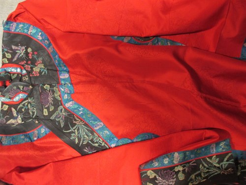 Lot 112 - A Chinese red and silk patterned lady's robe,...