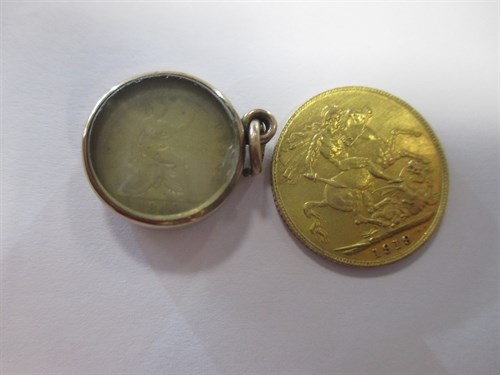 Lot 148 - A gold sovereign dated 1919, and a small 1849...