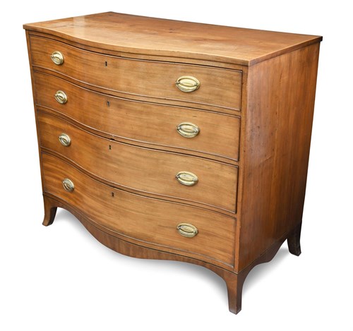 Lot 428 - A Regency mahogany serpentine chest, of four...
