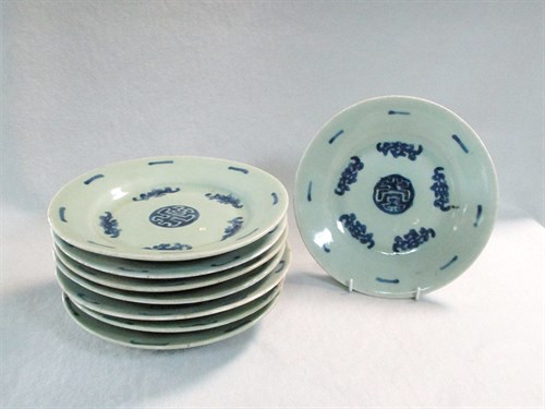 Lot 77 - Eight celadon glazed plates, 19th century, decorated in underglaze blue