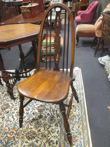 Lot 414 - A pair of hoop back Windsor chairs, the seats...