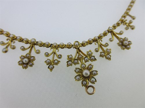 Lot 356 - A seed pearl fringe necklace and matched hinged bangle