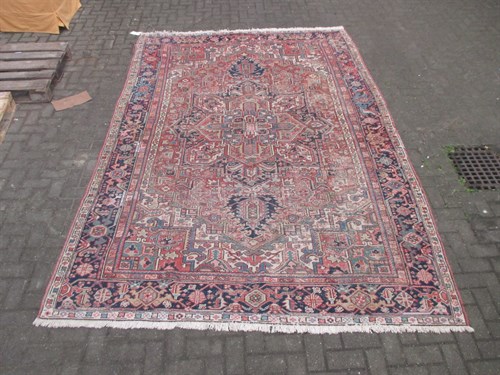 Lot 577 - A Eastern wool carpet, the cream ground with...