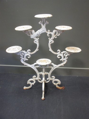Lot 477 - A cast iron six tray plant stand, 99cm high