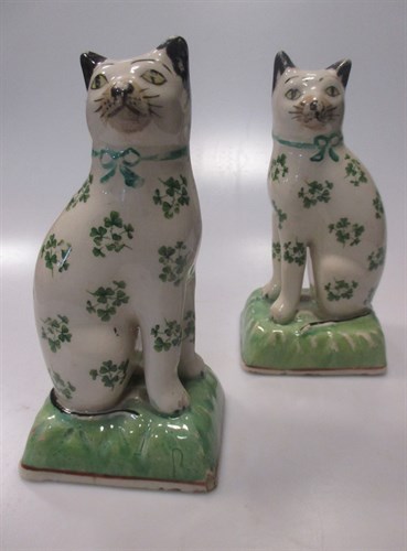 Lot 95 - A pair of Staffordshire pottery seated cats,...