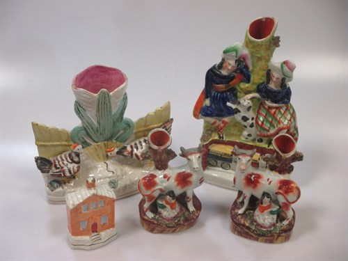 Lot 76 - A Victorian Staffordshire pottery spill group...